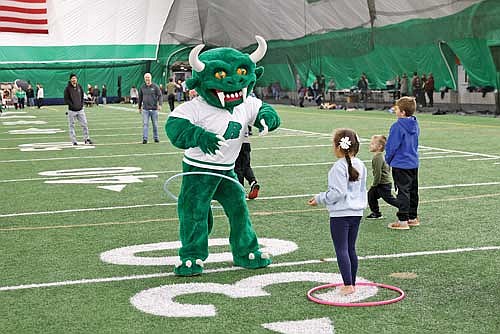 The Rhinelander Hodag mascot cheers while children demonstrate their hula hoop skills during the annual Hodag Day at the Dome event, Wednesday, Dec. 4. This event, hosted by the School District of Rhinelander, was a celebration of the Hodag’s 131st birthday. For additional photos, see Page 14. (Photo by Bob Mainhardt for the River News)