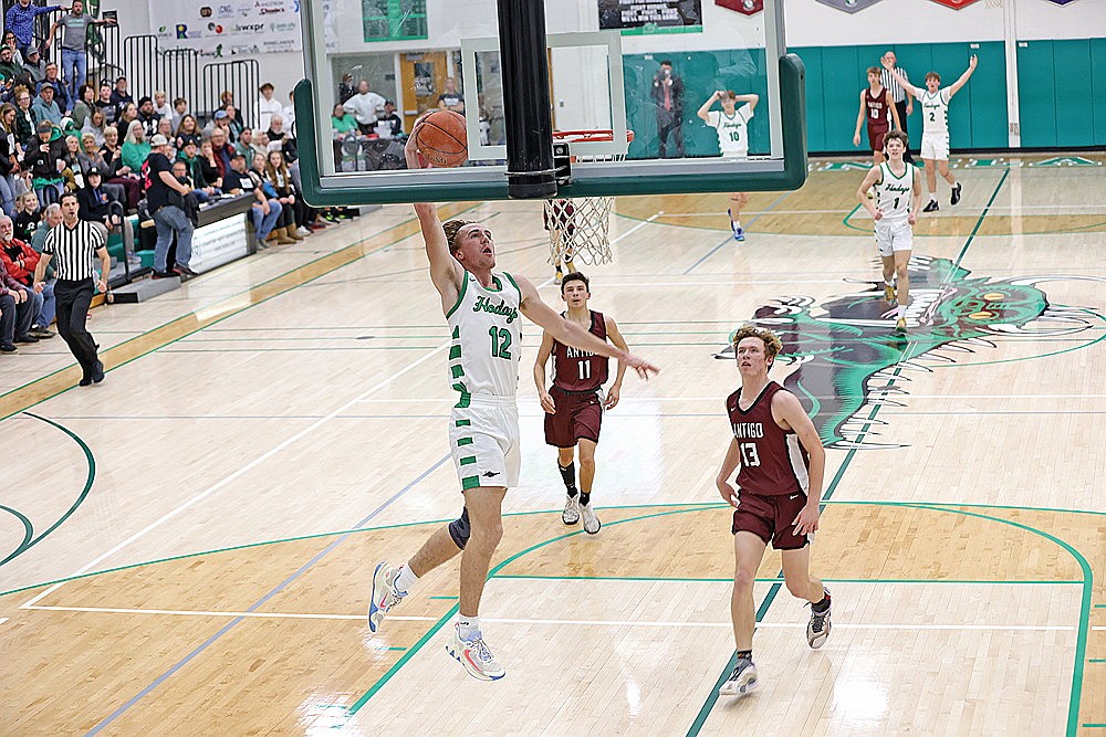 Rhinelander’s Truman Lamers dunks the basketball on a fast break during the first half of a GNC boys’ basketball game against Antigo at the Jim Miazga Community Gymnasium Friday, Dec. 6. Lamers scored a game-high 20 points in the Hodags’ 69-40 victory. (Bob Mainhardt for the River News)