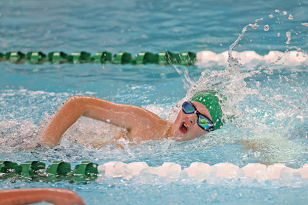 McCray Wagner competes in the boys’ 11 and over 100-yard freestyle.
