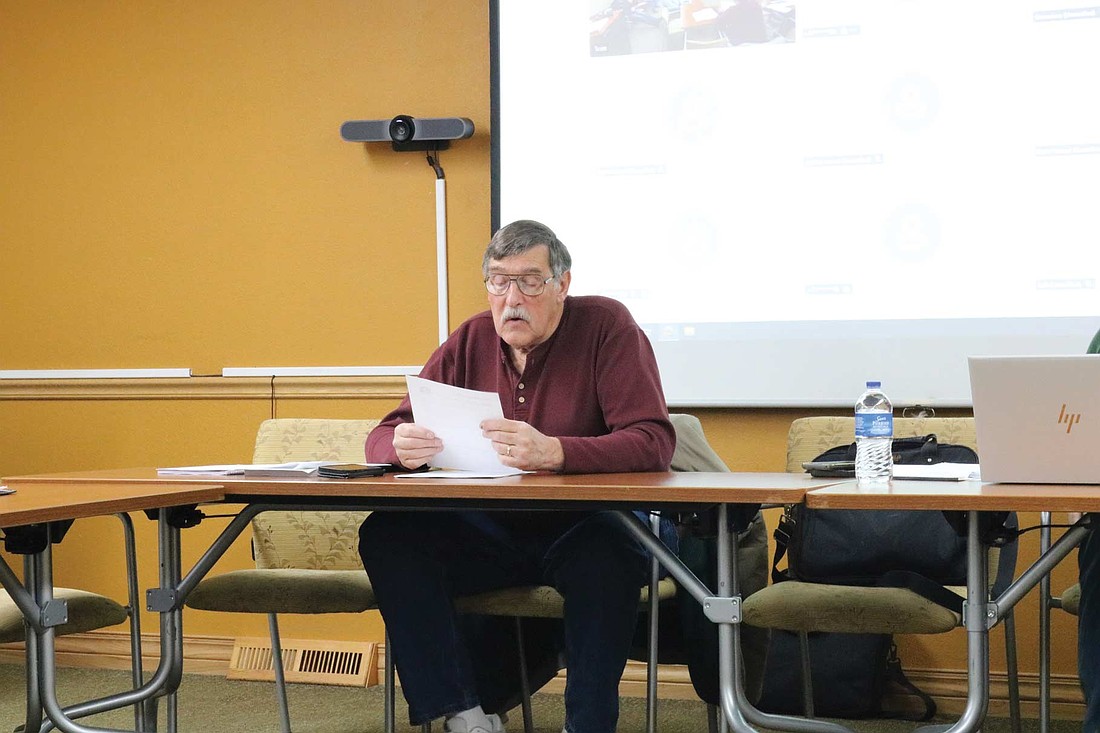Wisconsin Conservation Congress wolf advisory committee chair Ed Harvey read a citizen resolution to the committee asking whether there would be support to require a producer who experienced a wolf depredation to install some nonlethal abatement measure before being eligible for further depredation payments. (Photo by Beckie Gaskill/Lakeland Times)