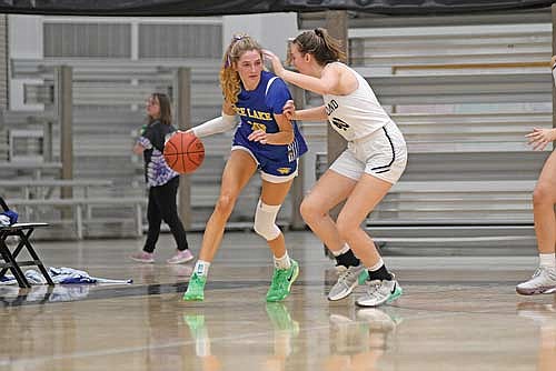 Ava Evenhouse guards Rice Lake’s Adaline Sheplee out on the perimeter in the second half Tuesday, Dec. 10 at Ted Voigt Court in Minocqua. Sheplee led all scorers with 21 points. (Photo by Brett LaBore/Lakeland Times)
