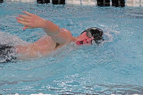 Garrison Jacques swims the 100 freestyle to victory against Antigo Thursday, Dec. 12 at the Lakeland Union High School pool in Minocqua. Jacques improved his personal-best time by four seconds. (Photo by Brett LaBore/Lakeland Times)