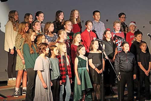 The sixth grade choir performs during the Middle School Winter Concert at the Arbor Vitae-Woodruff School on Thursday, Dec. 12, in Arbor Vitae. (Photo by Kate Reichl/Lakeland Times)