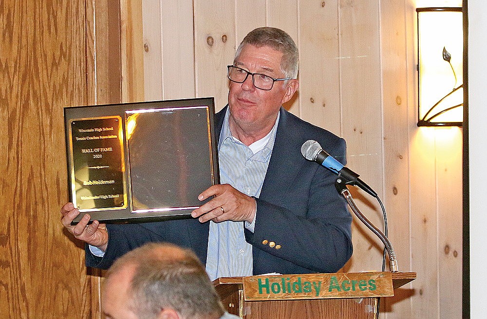 In this May 25, 2022 file photo, WIAA Assistant Director Tom Shafranski displays a plaque from the Wisconsin High School Tennis Coaches Association recognizing Bob Heideman’s induction into that association’s hall of fame during the Rhinelander Athletic Booster Club banquet at Holiday Acres Resort. Shafranski, who served as Rhinelander High School activities director from 1993-2000 has announced his retirement from the WIAA effective Feb. 7, 2025. (Bob Mainhardt for the River News)