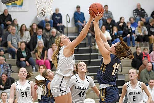 Saylor Timmerman blocks the shot attempt of Wausau West’s Ayla Christensen in the first half Tuesday, Dec. 17 at Ted Voigt Court in Minocqua. Timmerman scored a season-high 15 points. (Photo by Brett LaBore/Lakeland Times)
