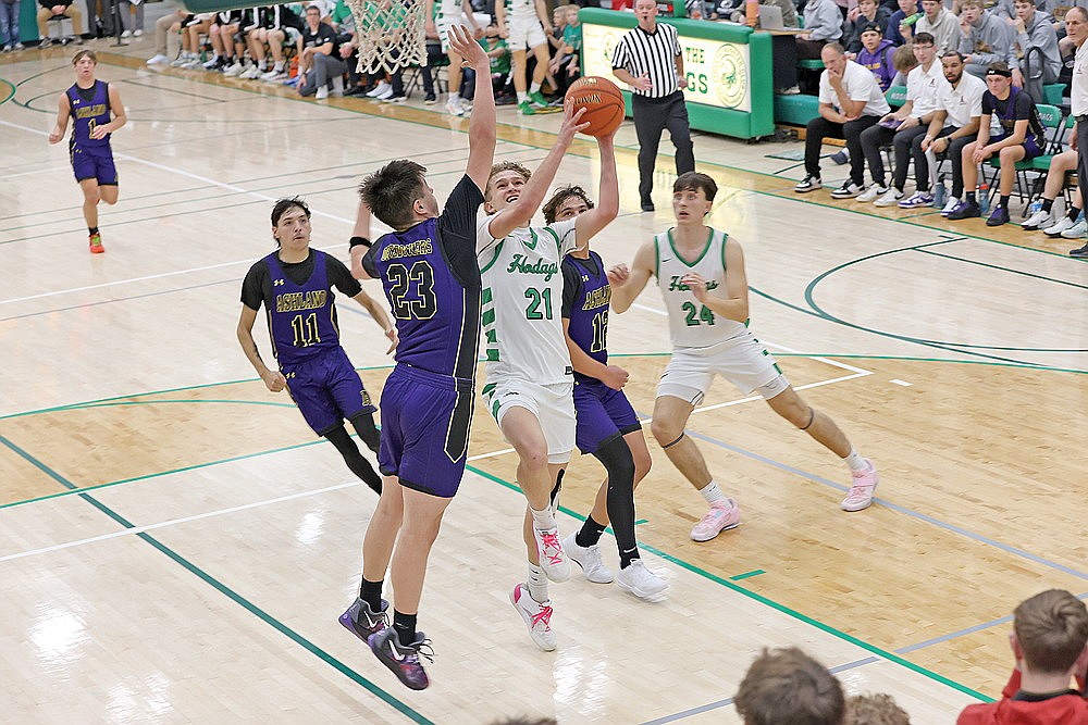 Rhinelander’s Abe Gretzinger drives to the basket against Ashland’s Gavin Greene (23) during the first half of a non-conference boys’ basketball game at the Jim Miazga Community Gymnasium Tuesday, Dec. 17. Gretzinger scored 11 points in the Hodags’ 76-34 victory. (Bob Mainhardt for the River News)