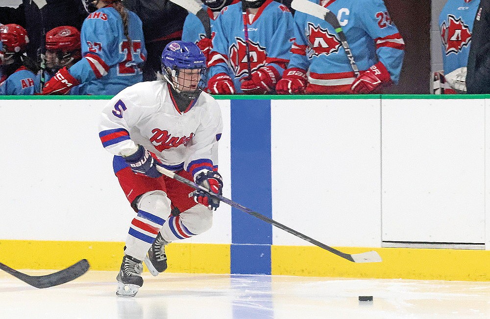 Reese Retallick handles the puck during a girls’ hockey game between the Northland Pines and Arrowhead co-ops in Medford Saturday, Dec. 14. Retallick, a sophomore from Rhinelander, had a goal and an assist Tuesday as the Eagles defeated Medford, 7-4. (Matt Frey/Star News)