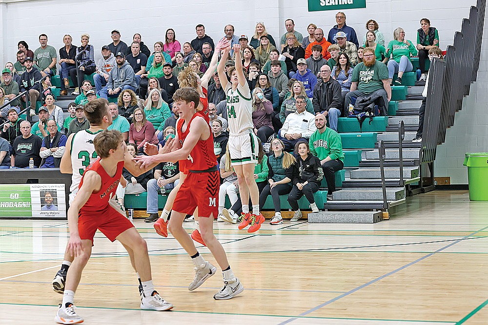 In this Feb 22, 2024 file photo, Rhinelander’s Will Gretzinger attempts a 3 over Medford’s Owen Stockwell during the second half of a GNC boys’ basketball game at the Jim Miazga Community Gymnasium. The Hodags knocked off Mosinee and Medford in the final two games of the regular season to earn a share of the GNC title. (Bob Mainhardt for the River News)