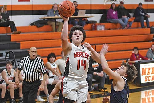 Laken Walker scores a basket in the second half against Tomahawk Thursday, Dec. 19 at Coach Leverson Court in Mercer. (Photo by Brett LaBore/Lakeland Times)