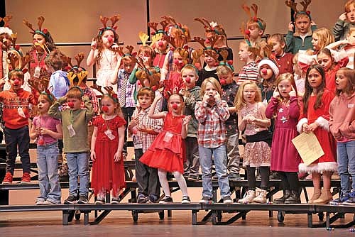 Students from Central Elementary School sing “Rudolph the Red-Nosed Reindeer” during their concert Thursday, Dec. 19 at the John and Dori Brown Performing Arts Center. (Photo by Bob Mainhardt for the River News)