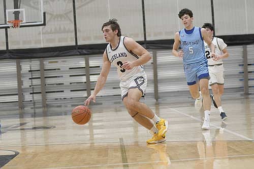 Noah Bruckner takes the ball inside the arc during the second half against Merrill Monday, Dec. 30 at Ted Voigt Court in Minocqua. (Photo by Brett LaBore/Lakeland Times)