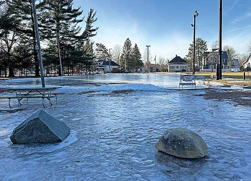 With temperatures in the low 40s, popular winter activities such as ice skating at the outdoor rink at Rhinelander’s Pioneer Park were unavailable on Monday, Dec. 30. Coolers temperatures and light snow are forecasted for the next few days, which might help those hoping to enjoy snow-related activities. (Photo by Heather Schaefer/River News)