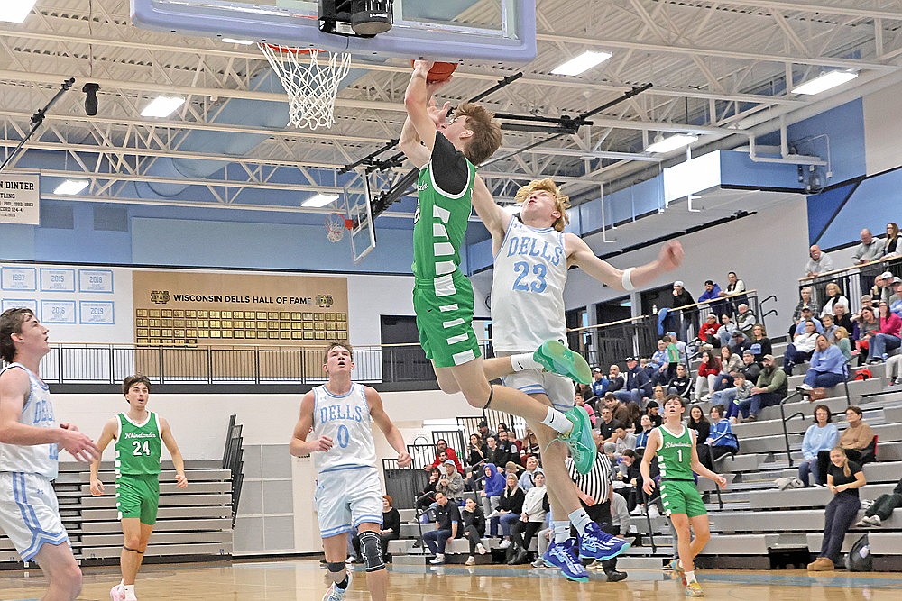 Rhinelander’s Seth Nofftz has a shot blocked by Wisconsin Dells’ Brady Young during the first half of a non-conference boys’ basketball game in Wisconsin Dells Saturday, Dec. 28. The Hodags suffered their first loss of the season, Saturday, falling to the Chiefs 70-42. (Jeremy Mayo/River News)