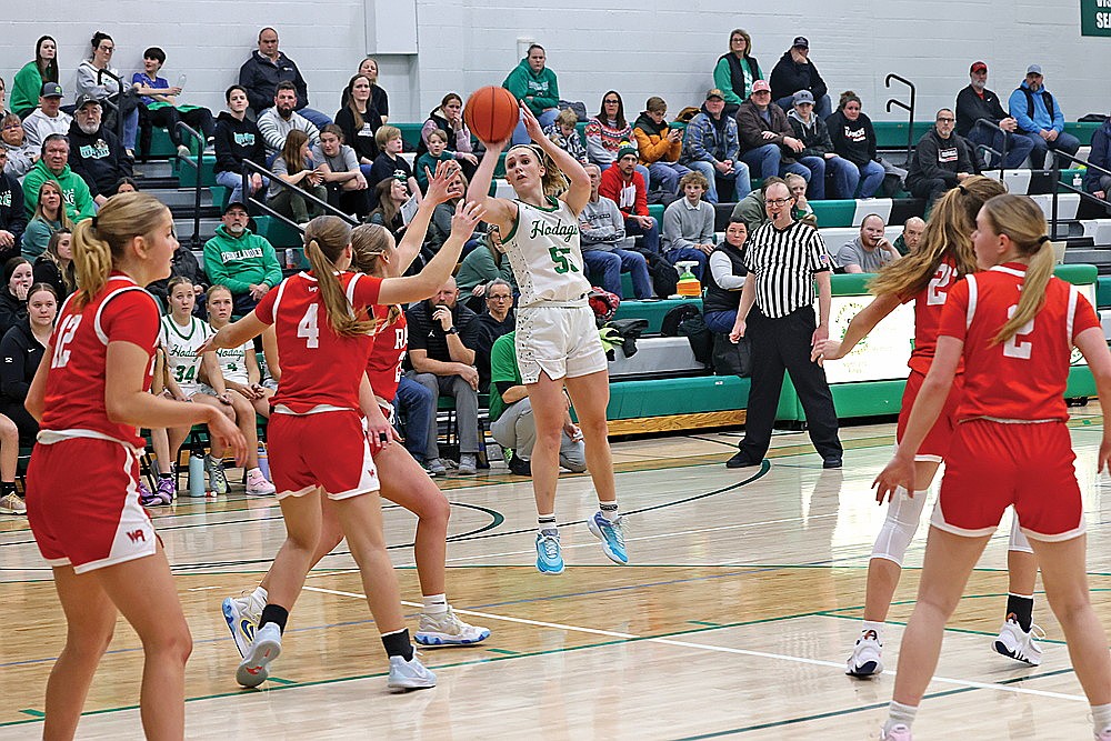 Rhinelander’s Aubryn Clark attempts a shot over Wisconsin Rapids’ Lexi Cour during the second half of a non-conference girls’ basketball game at the Jim Miazga Community Gymnasium Friday, Jan. 3. The Hodags were held to 29% shooting Friday night and missed the final nine shots from the field as they fell to the Raiders, 47-38. (Bob Mainhardt for the River News)