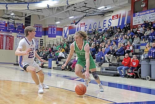 Rhinelander’s Truman Lamers dribbles inside the arc during a game against Northland Pines Dec. 13, 2024 at Northland Pines High School in Eagle River. Lamers contributes 16.6 points per game for the Hodags. (Photo by Jeremy Mayo/River News)