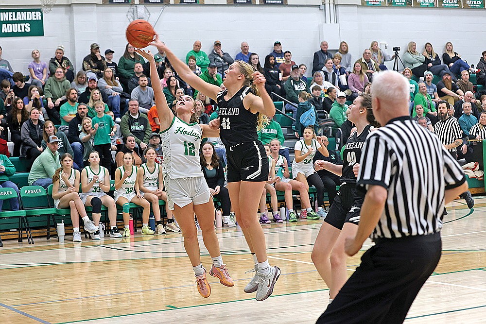 Rhinelander’s Ella Miljevich has a shot blocked by Lakeland’s Saylor Timmerman during the second half of a GNC girls’ basketball game at the Jim Miazga Community Gymnasium Friday, Jan. 10. Lakeland defeated Rhinelander 62-28 in a battle of the conference’s two remaining unbeaten teams. (Bob Mainhardt for the River News)