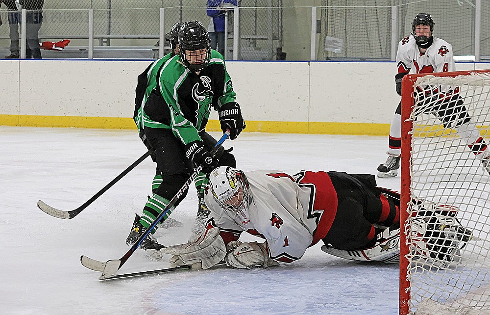 Rhinelander’s Logan Leonard beats Medford’s Talan Albers for a goal during the third period of a non-conference boys’ hockey game in Merrill Saturday, Jan. 11. Leonard scored twice in the third periods as the Hodags snapped a nine-game losing streak with a 5-3 victory over the Raiders. (Jeremy Mayo/River News)