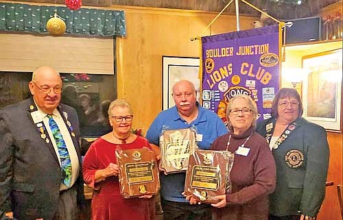 Boulder Junction Lion Wendi Neupert and Lions Mike and Sharon Pleasant are named Melvin Jones Fellows by Lions Clubs International Foundation (LCIF). Those attending the ceremony are, from left, Lion Bob Bertch, 27-C2 Past District Governor and Boulder Junction Lions Club Secretary; Lion Sharon Pleasant; Lion Mike Pleasant; Lion Wendi Neupert; and Lion Anne Madison, 27-C2 Acting District Governor. (Contributed photograph)
