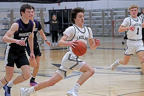 Benny Gahler takes the ball inside the arc in the second half against Mosinee Friday, Jan. 17 at Ted Voigt Court in Minocqua. Gahler led Lakeland with 11 points. (Photo by Kate Reichl/Lakeland Times)