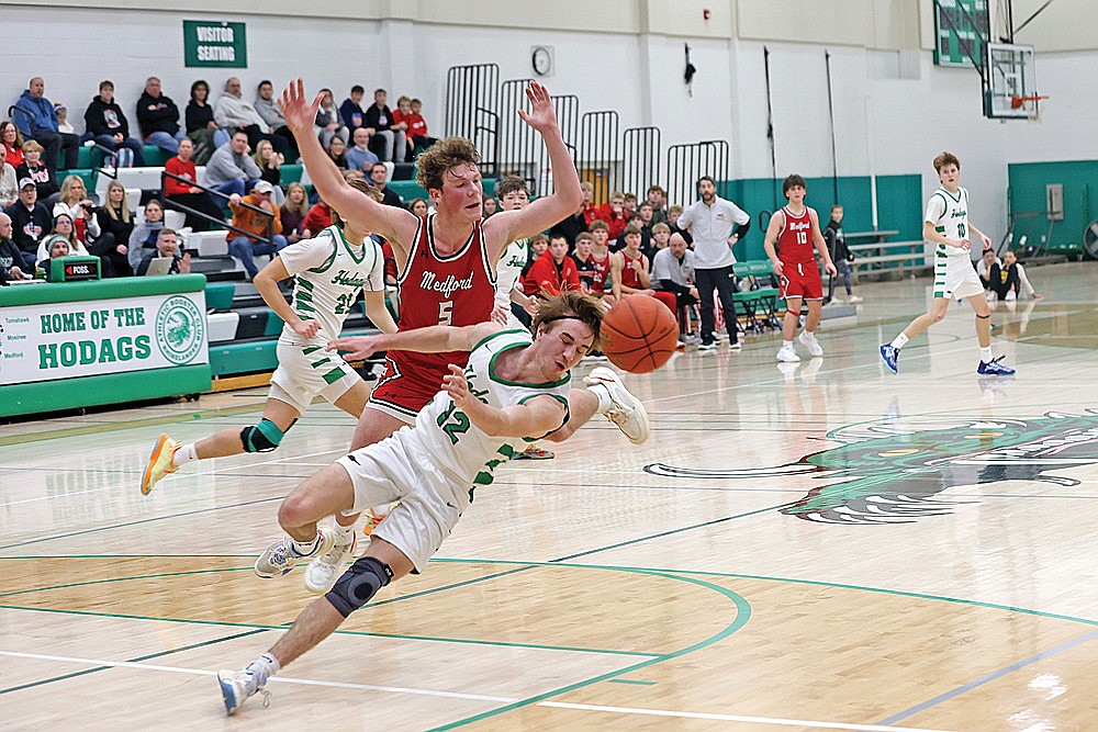 Rhinelander’s Truman Lamers fouls Medford’s Charlie Gierl late in the second half of a GNC boys’ basketball game at the Jim Miazga Community Gymnasium Friday, Jan. 17. Gierl scored a game-high 32 points as Medford defeated Rhinelander 71-63 and moved into a first-place tie in the GNC with the Hodags.