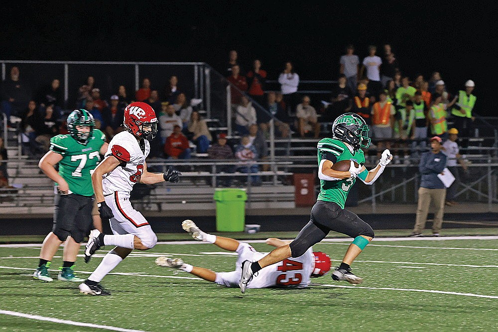 In this Sept. 13, 2024 file photo Rhinelander’s Sam Zwaard runs for an 86-yard touchdown run during a GNC football game against Wausau East at Mike Webster Stadium. Rhinelander’s win over Wausau East would have been valuable under a playoff matrix proposed by the WFCA because of East’s 6-3 overall record. (Bob Mainhardt for the River News)