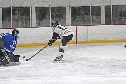 Cooper Johnson scores a goal in the third period against Fond du Lac Springs Friday, Jan. 24 at Lakeland Hawks Ice Arena in Minocqua. (Photo by Brett LaBore/Lakeland Times)