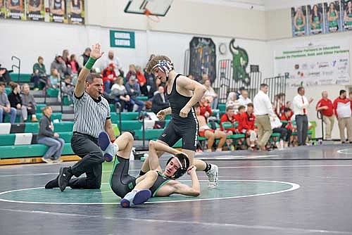 Evan Hastreiter pins Rhinelander’s Trevor Denton in the 113-pound weight class during a conference quad Thursday, Jan. 23 at Jim Miazga Community Gymnasium in Rhinelander. Hastreiter achieved the pin in 27 seconds. (Photo by Bob Mainhardt for the River News)