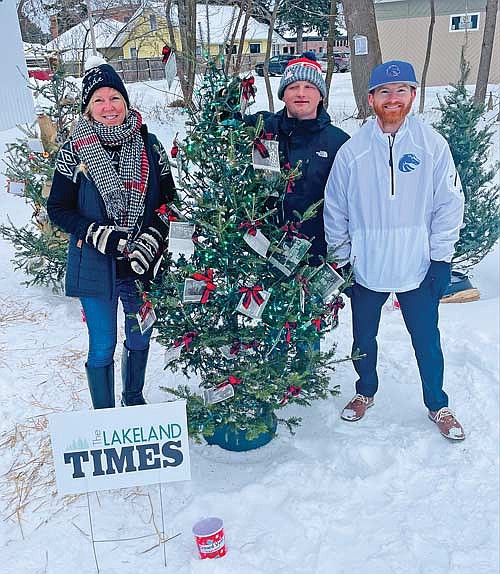 The decorators for the The Lakeland Times entry in the first “Festival of Trees” at the Bottled Bean in Minocqua were support specialist, subscriptionist and classified advertisement representative Holly Gawlik, reporter and assistant editor Trevor Greene and sports reporter Brett LaBore. (Photo by Brian Jopek/Lakeland Times)