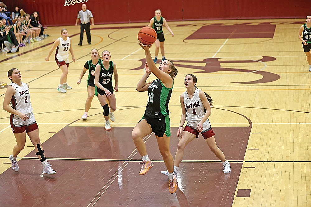 Rhinelander’s Ella Miljevich drives in for a layup during the first half of a GNC girls’ basketball game at Antigo Friday, Jan. 24. Miljevich recorded career-highs with 12 points and 13 rebounds as the Hodags defeated the Red Robins, 67-35. (Bob Mainhardt for the River News)