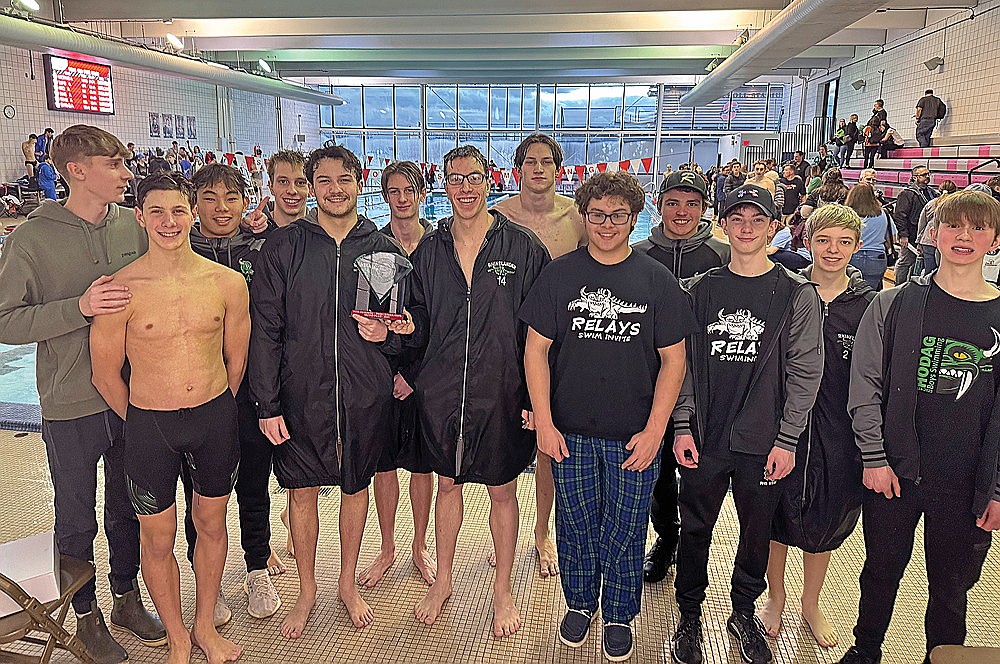 The Rhinelander High School boys’ swim team poses with the runner-up trophy after taking second in the Small School State Invite at Shorewood High School Saturday, Jan. 25. The Hodags finished only eight points behind defending WIAA Division 2 state champion McFarland in the meet. (Submitted photo)