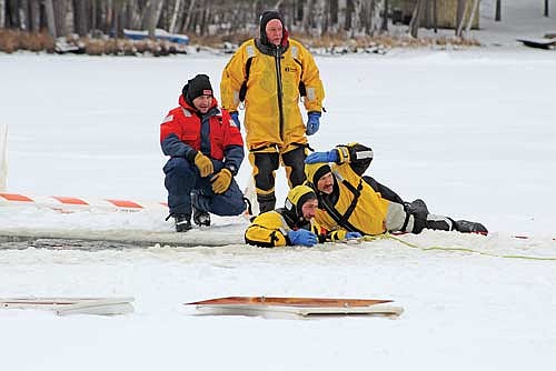 Firefighters from several local fire departments braved the elements to participate in an ice rescue training session on Lake Killarney  on Saturday, January 25, 2025. (Submitted photo)