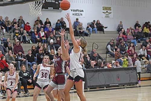 Alyssa Erickson scores a basket with the foul against the defense of Antigo’s Jewel Weix in the second half of a conference game Friday, Jan. 31 at Ted Voigt Court in Minocqua. The win improved Lakeland’s conference record to 9-0. (Photo by Brett LaBore/Lakeland Times)