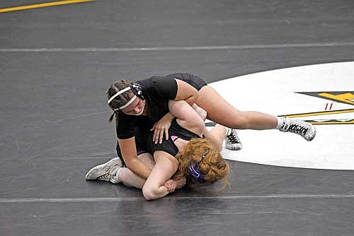 Moriah Louis gets on top of Mosinee’s Shelby Chaney in the 138-pound weight class during a conference quad Thursday, Jan. 30 at the Lakeland Union High School fieldhouse in Minocqua. Louis got a pin in three minutes. (Photo by Brett LaBore/Lakeland Times)