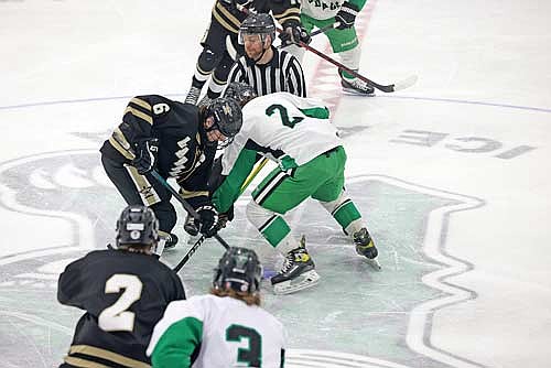 Lawson Bain faces off against Rhinelander’s Nathan Cordy in an 8-0 victory Thursday, Jan. 30 at the Rhinelander Ice Arena. Bain scored four goals in the game. (Photo by Bob Mainhardt for the River News)