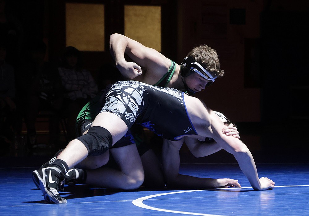 Rhinelander’s Logan Schwinger battles Laona/Wabeno/Three Lakes’ Brody Hoffman during a non-conference wrestling dual in Three Lakes Thursday, Jan. 30. Schwinger won both of his matches Thursday as the Hodags split their duals in the triangular meet. (Jeremy Mayo/River News)