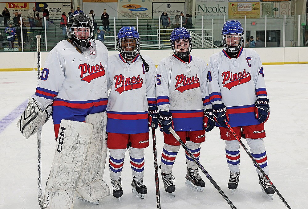 Rhinelander High School’s skaters on the Northland Pines girls’ hockey co-op, from left to right Jalyn Zadnik, Mia Tulowitzky, Reese Retallick and Emalee Detienne, pose for a photograph following a game against the Fox Cities Stars at the Rhinelander Ice Arena Monday, Feb. 3. For Zadnik, Tulowitzky and Detienne, Monday’s game marked their first contest in Rhinelander in more than two years. (Bob Mainhardt for the River News)