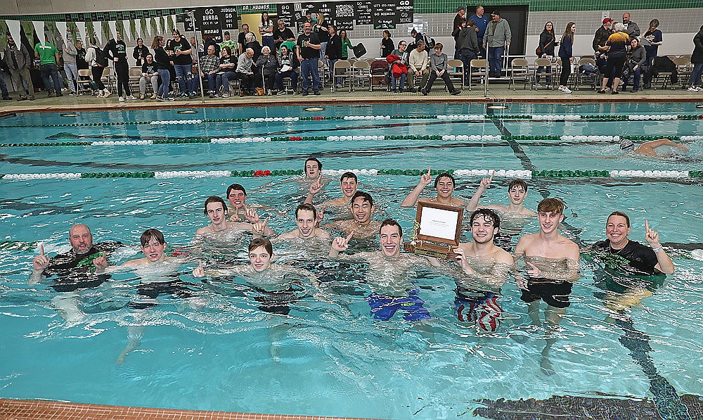 The Rhinelander High School boys’ swim team celebrates in the water after winning its seventh consecutive Great Northern Conference championship Friday, Feb. 7 at the Heck Family Community Pool. Rhinelander won all 11 events and broke seven conference records. (Bob Mainhardt for the River News)