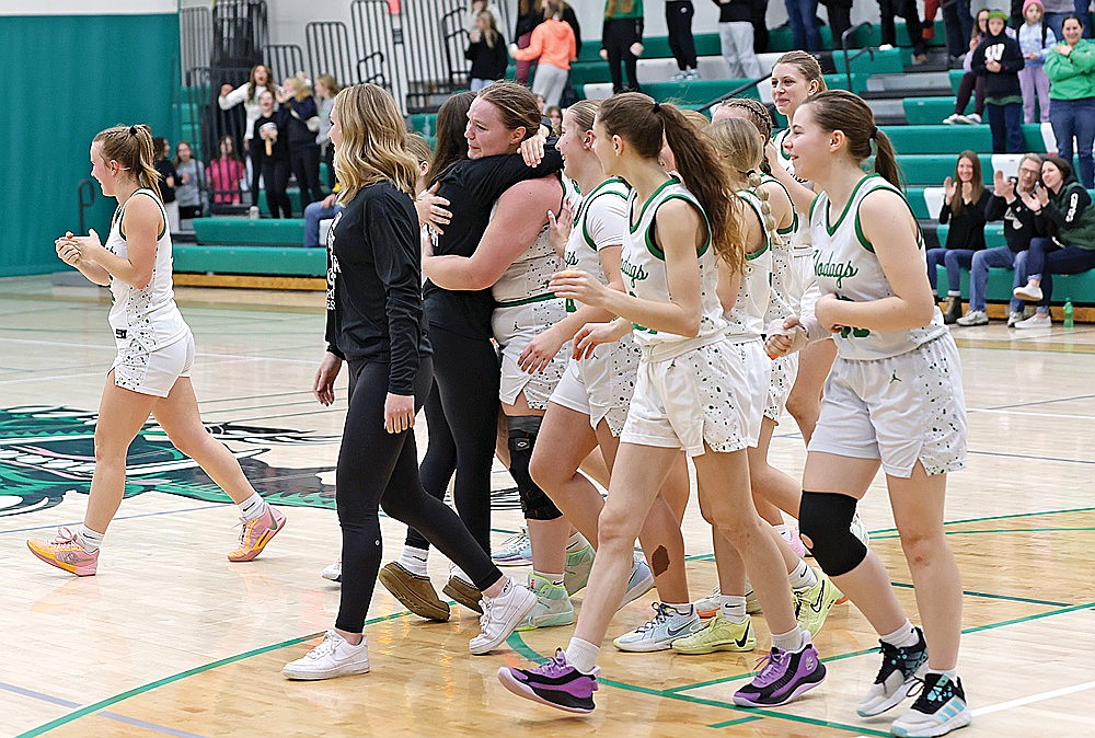 Rhinelander teammates congratulate senior Makenna Sternitzky after she made a basket at the end of a GNC girls’ basketball game against Tomahawk at the Jim Miazga Community Gymnasium Friday, Feb. 7. She scored in her first game action since Dec. 13 as the Hodags defeated the Hatchets, 52-32. (Bob Mainhardt for the River News)