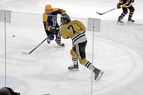 Noah Dube buries the puck in the second period of a 6-0 win over Ashland Thursday, Feb. 13 at Lakeland Hawks Ice Arena in Minocqua. (Photo by Brett LaBore/Lakeland Times)