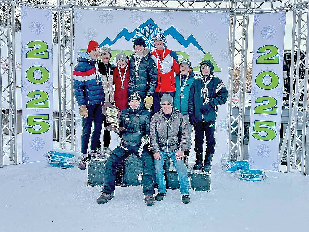 The Rhinelander/Northland Pines boys’ Alpine ski team stands on the podium after placing third in Division 2 at the WIARA State Championships in La Crosse Monday, Feb. 17. Sitting in the front row are coaches Rod Olson and Greg McGuire. Standings, from left to right are, Holden Schmitz, Henry Schmitz, Wyler Koput, Ben Olson, Jason Linn, Eli Repenshek and Michael Brunette. (Submitted photo)