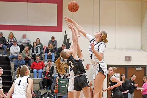 Bobbi Lee sinks a floater over the contest of Shawano’s Leah Nordin in the first half of a non-conference game Tuesday, Feb. 18 at Shawano Community High School. (Photo by Brett LaBore/Lakeland Times)