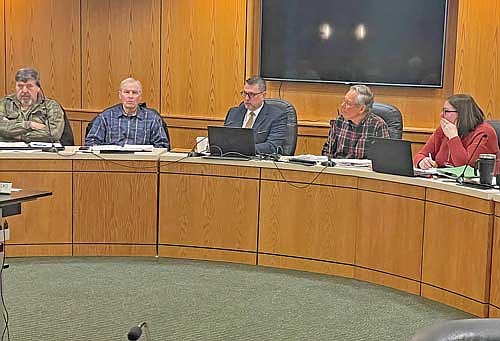 Members of the Oneida County Board of Adjustment listen to attorney Ronald Stadler address Kirk Bangstad during the Feb. 20 meeting of the Oneida County Board of Adjustment. From left, Russ Viergut, Mike Pasternak, Stadler, chairman Guy Hanson and Erica Sauer, a program assistant with the Oneida County planning and zoning department. (Photo by Brian Jopek/Lakeland Times)