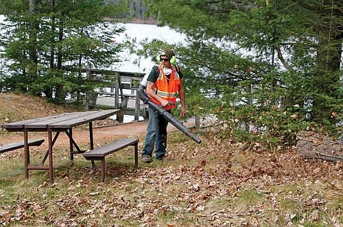 Seasonal staff are responsible for a variety of tasks including groundskeeping. (Photo by Dean Hall/Lakeland Times)