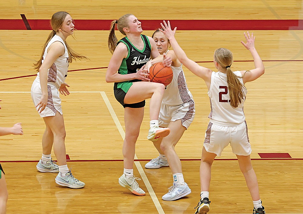 Rhinelander’s Vivian Lamers has the ball stripped by Menomonie’s Gracie Miller during the second half of a WIAA Division 2 girls’ basketball playoff game Friday, Feb. 28. Menomonie defeated Rhinelander 57-42. (Jeremy Mayo/River News)