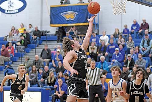 Noah Bruckner makes a layup in the first half of a WIAA Division 2 regional quarterfinal game against Rice Lake Tuesday, March 4 at Harold G. (Ole) Olsen Gymnasium in Rice Lake. Bruckner finished with 12 points to conclude his Lakeland career. (Photo by Brett LaBore/Lakeland Times)