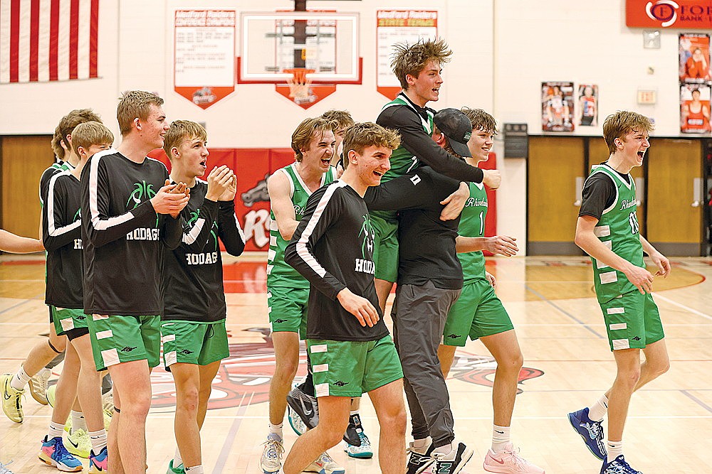 The Rhinelander High School boys’ basketball team celebrates after defeating Medford for the Great Northern Conference championship in Medford Thursday, Feb. 27. The Hodags are the second seed in their regional entering the start of the WIAA playoffs this evening and will host seventh-seeded Rice Lake at the Jim Miazga Community Gymnasium. It’s a rematch of last year’s regional semifinal won by Rice Lake 57-45 in Rice Lake. (Bob Mainhardt for the River News)