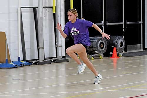 Kieran Petrie runs the 40-meter dash during the first day of practice Monday, March 10 at the Lakeland Union High School fieldhouse in Minocqua. (Photo by Brett LaBore/Lakeland Times)