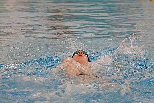 In this Feb. 15, 2025 file photo, Garrison Jacques does the backstroke portion of the 200 IM during a WIAA Division 2 sectional meet at Ashwaubenon High School. (Photo by Jeremy Mayo/River News)