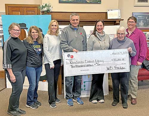 Those pictured for the check presentation, from left, are: LeeAnnette Schmidmayr, Foundation Recording Secretary; Denise Chojnacki, Children’s Services Manager of the Rhinelander District Library; Leah Van Zile, WPS Foundation Representative; Jeremy Baker, WPS Senior Service Manager; Heather Sturtevant, Foundation Treasurer; Mary Pautz, Foundation Board Member; and Virginia Roberts, Director of the Rhinelander District Library. (Contributed photograph)