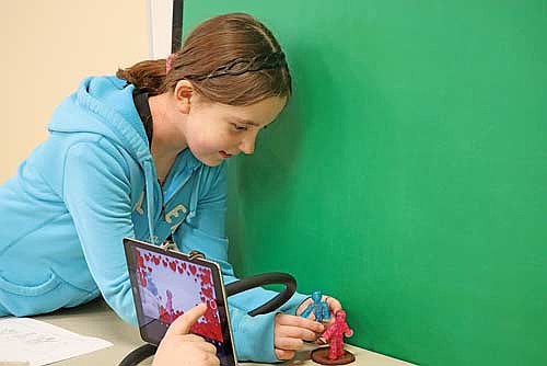 Nine-year-old Alivia Heil adjusts her figures during a Stop Motion Animation event on Thursday, March 20, at the Minocqua Public Library. (Photo by Kate Reichl/Lakeland Times)
